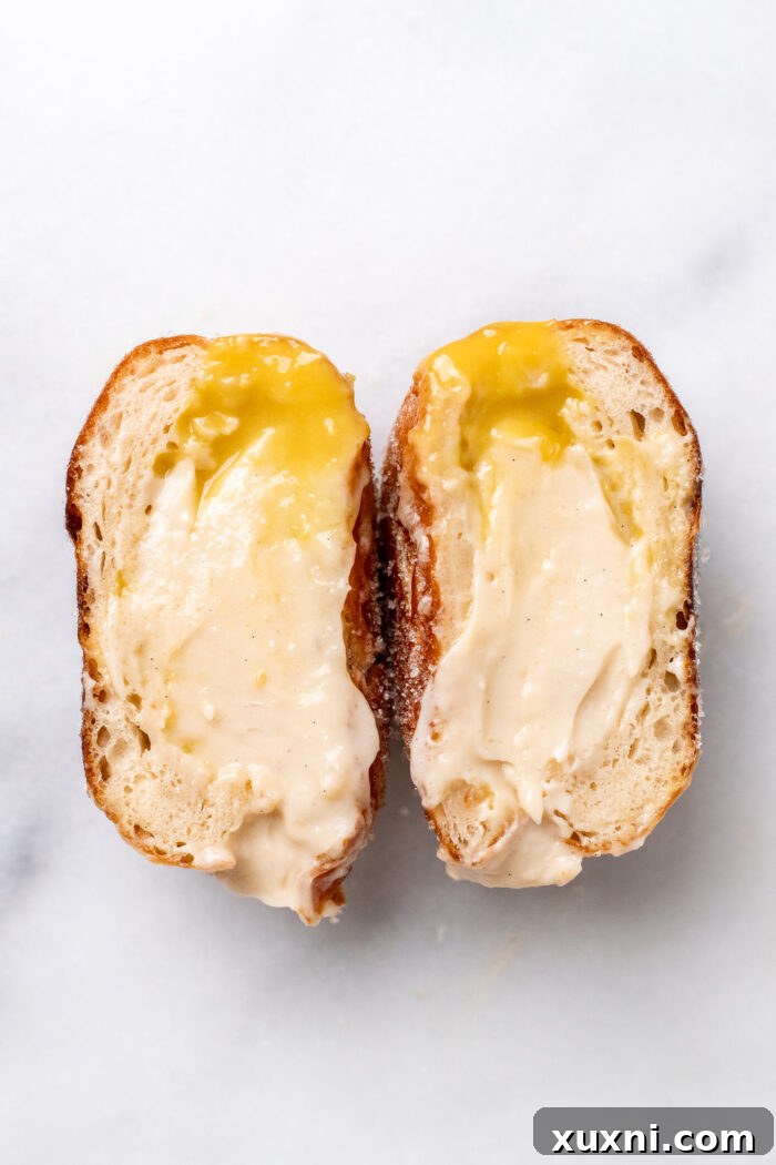 sliced open bomboloni on marble