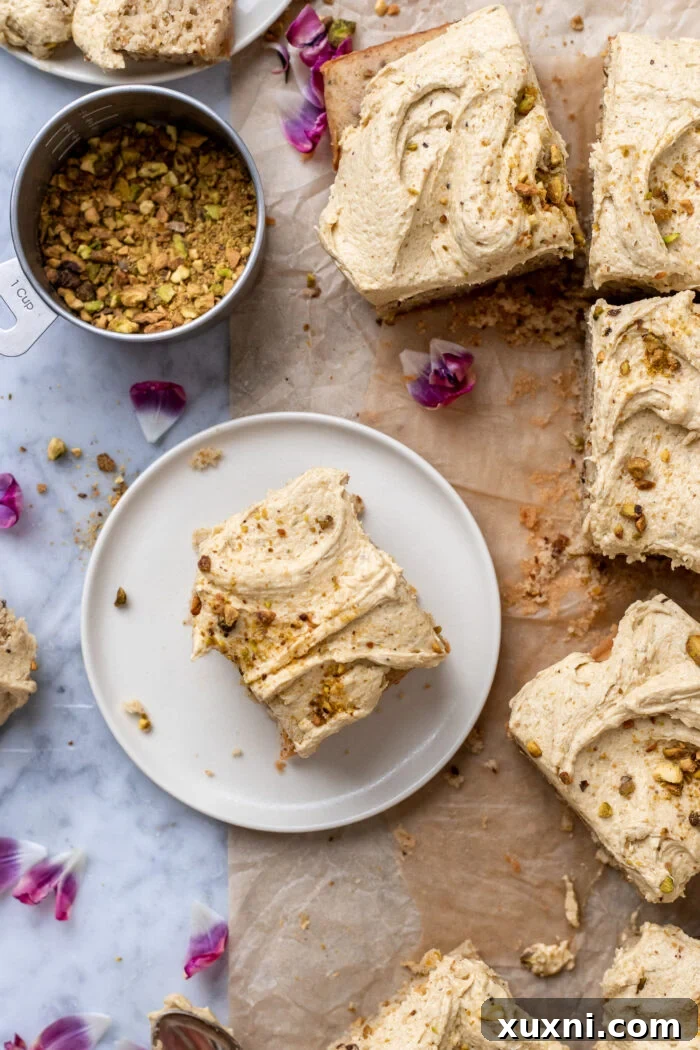 Several slices of vegan pistachio cake arranged on a serving plate.