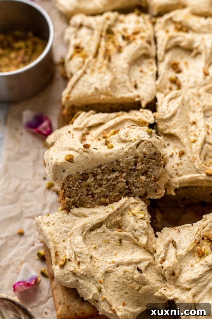 A perfectly baked and frosted pistachio sheet cake, ready to be sliced and served.