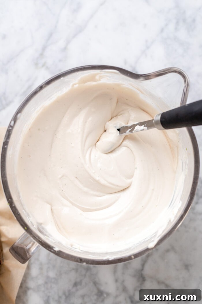 Key lime cheesecake batter in a bowl, ready to be poured