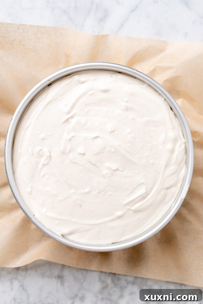 Key lime cheesecake batter poured into the crust, ready for baking