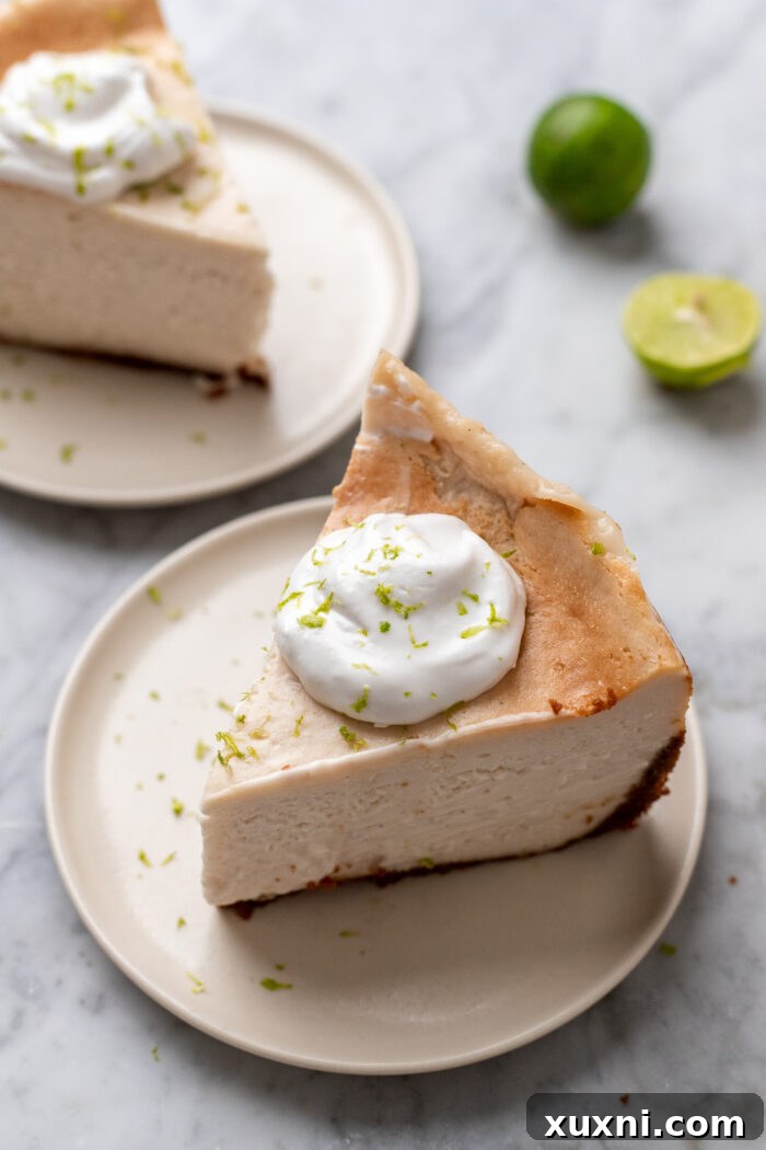 Several slices of vegan key lime cheesecake on a white plate