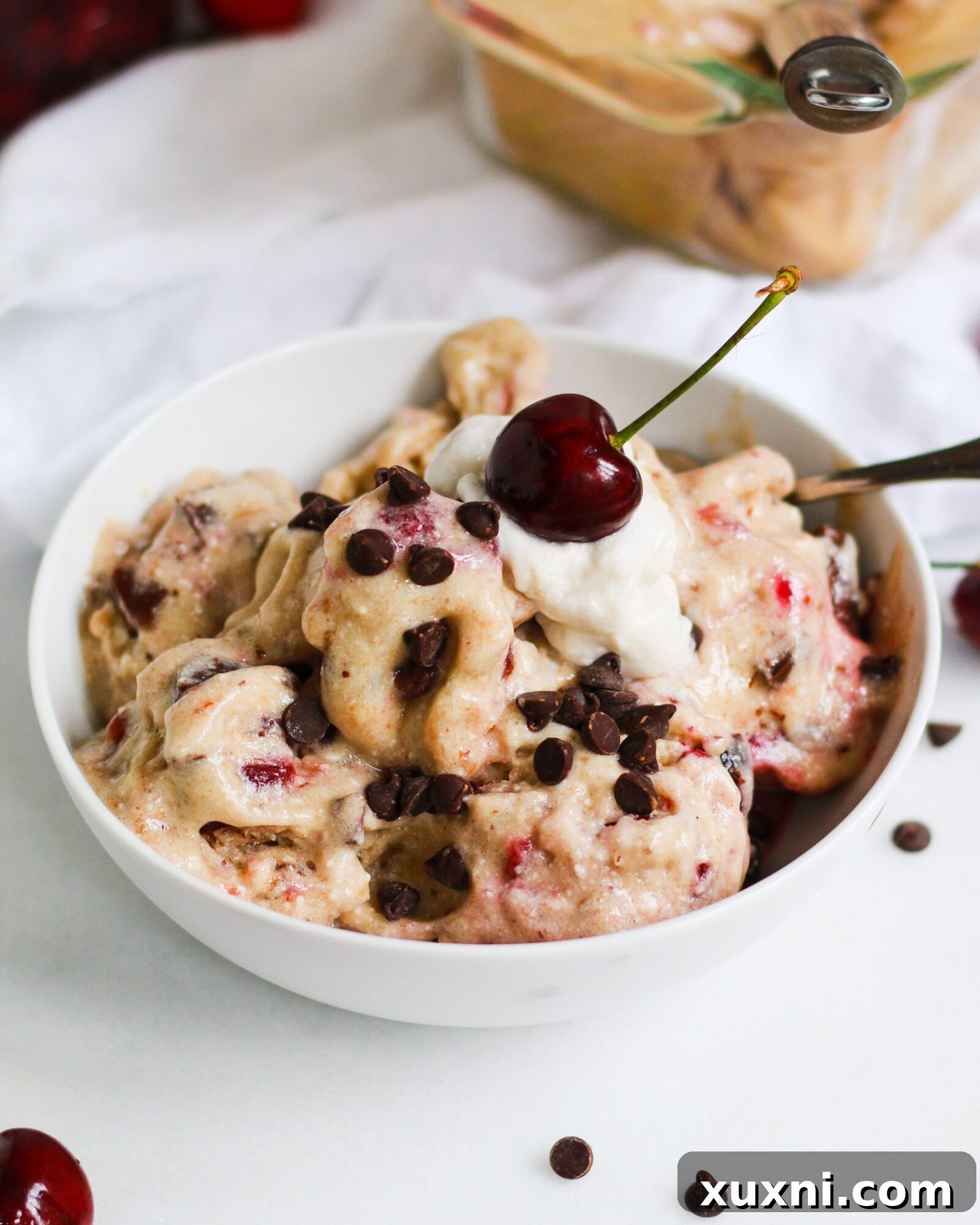paleo cherry garcia ice cream with coconut cream and a cherry on top