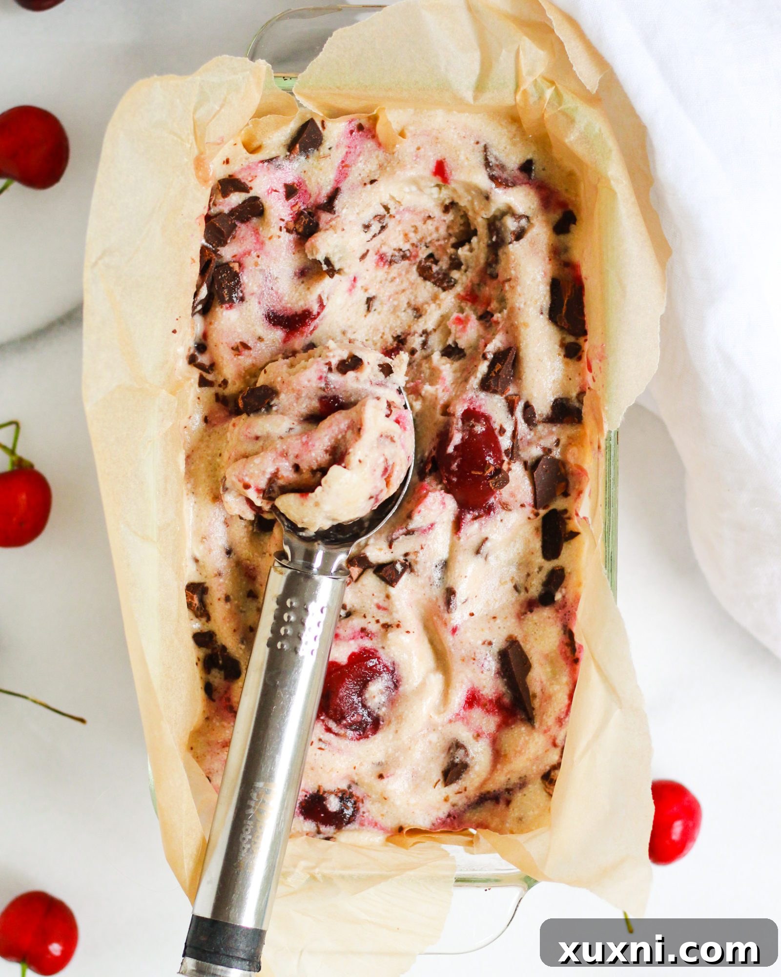 Paleo chocolate cherry ice cream with scoop in it