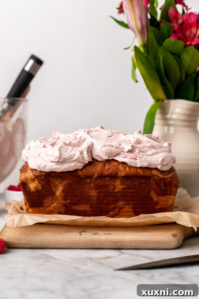 Frosted vegan raspberry pound cake with raspberry buttercream