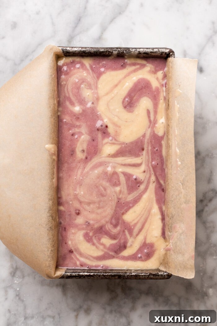 Swirling the cake batter in the loaf pan