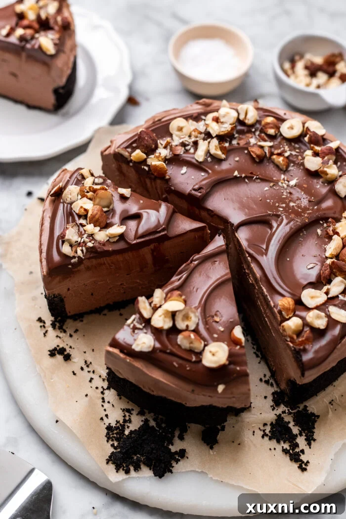 Another enticing shot of a sliced vegan Nutella cheesecake, showcasing its elegant presentation and creamy layers.