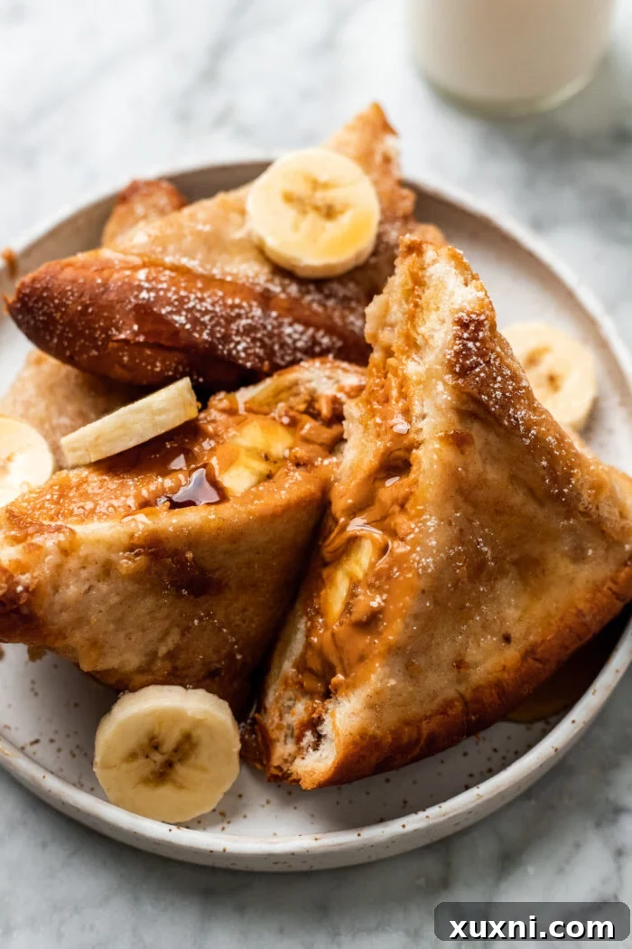 stuffed French toast on a plate with milk