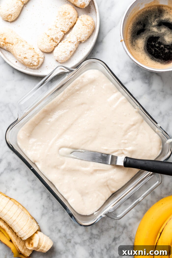 banana pudding tiramisu being assembled.