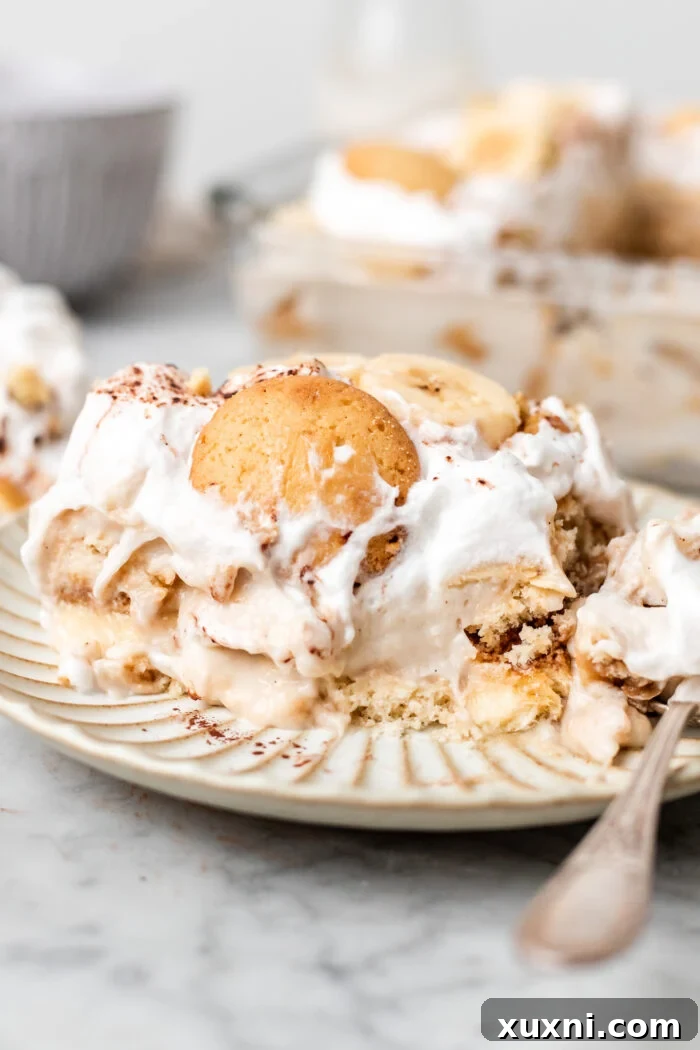 bitten slice of vegan banana pudding tiramisu