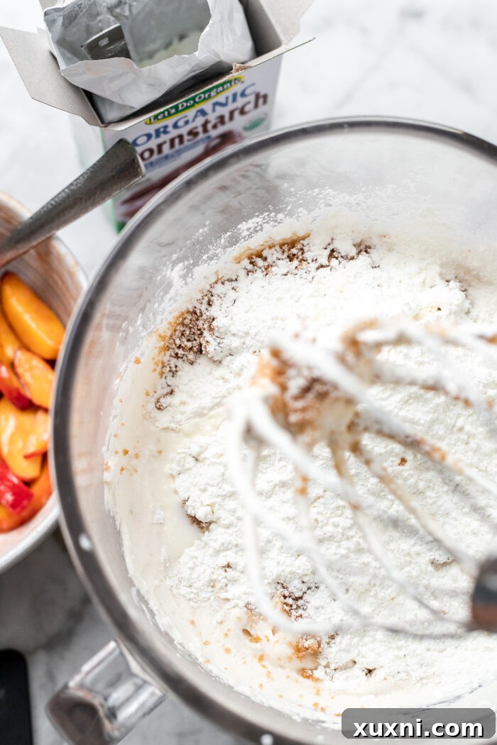 Smooth and creamy vegan cheesecake batter in a mixing bowl, perfectly whipped.