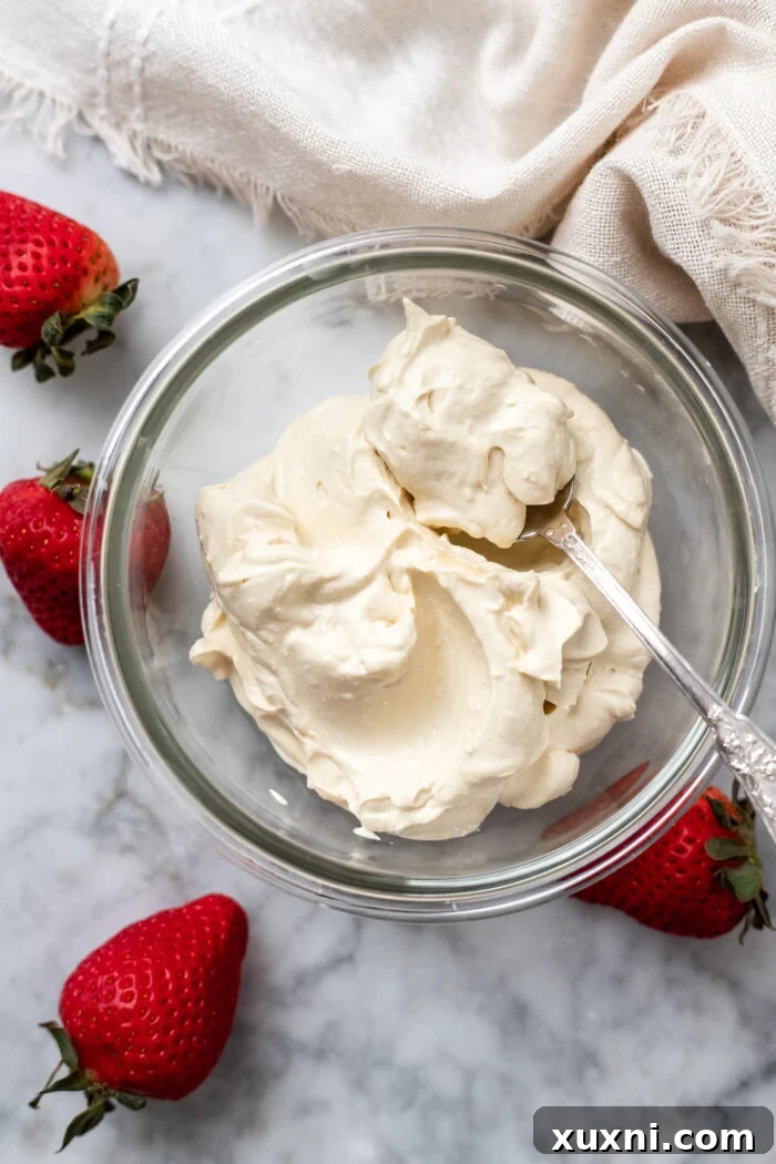 A rustic bowl filled with creamy vegan mascarpone, ready for use or storage.