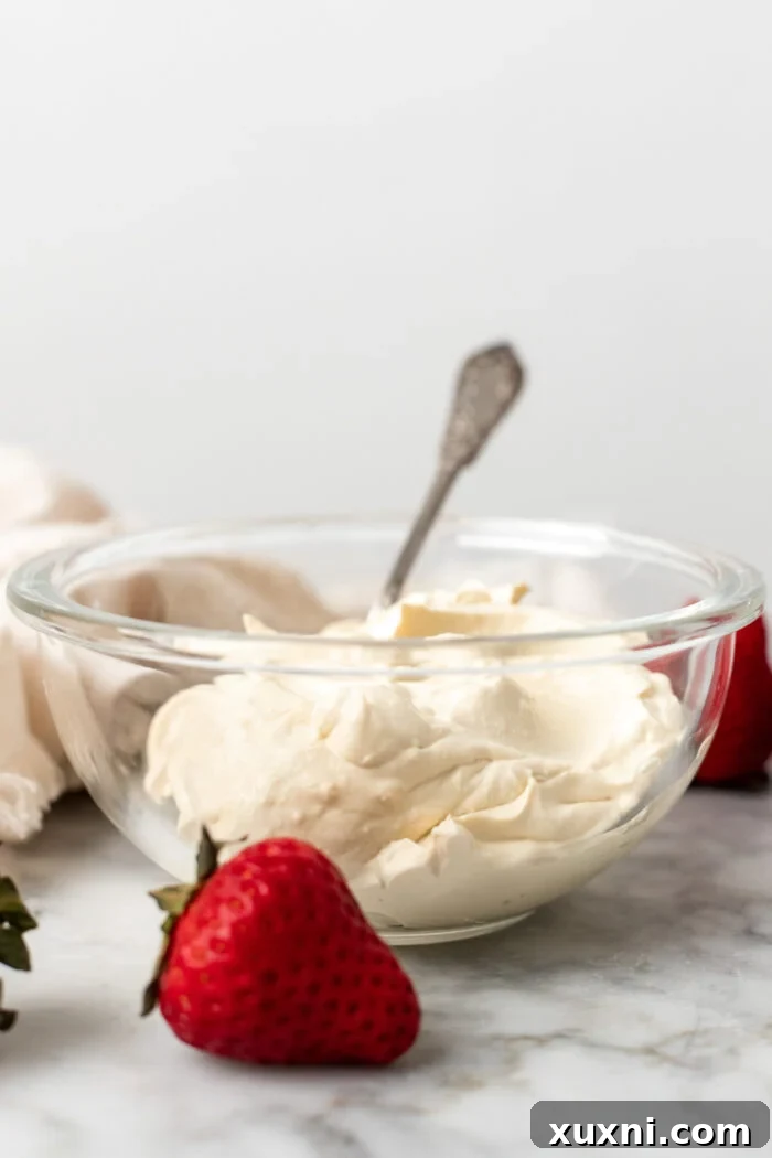 A close-up of a bowl filled with smooth, white vegan mascarpone, ready to be used in sweet or savory dishes.
