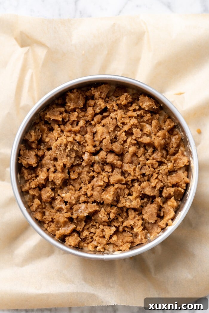Unbaked banana coffee cake with crumb topping, ready for the oven.