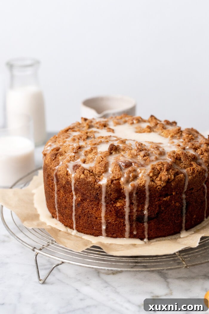 Iced banana coffee cake with a drizzle of white glaze.