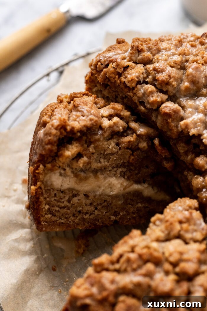 Perfectly sliced coffee cake with visible layers, ready to be served.