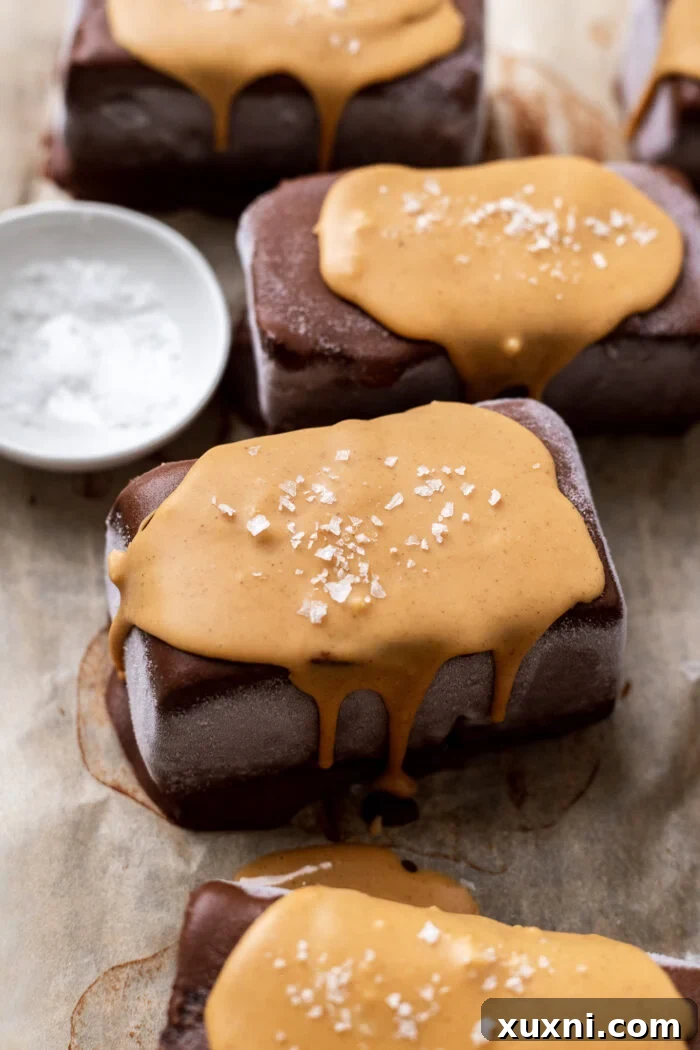 Easy Vegan Chocolate Peanut Butter Ice cream Sandwiches on parchment paper