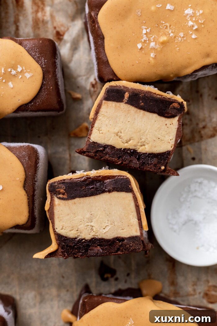 sliced Easy Vegan Chocolate Peanut Butter Ice cream Sandwiches on parchment paper