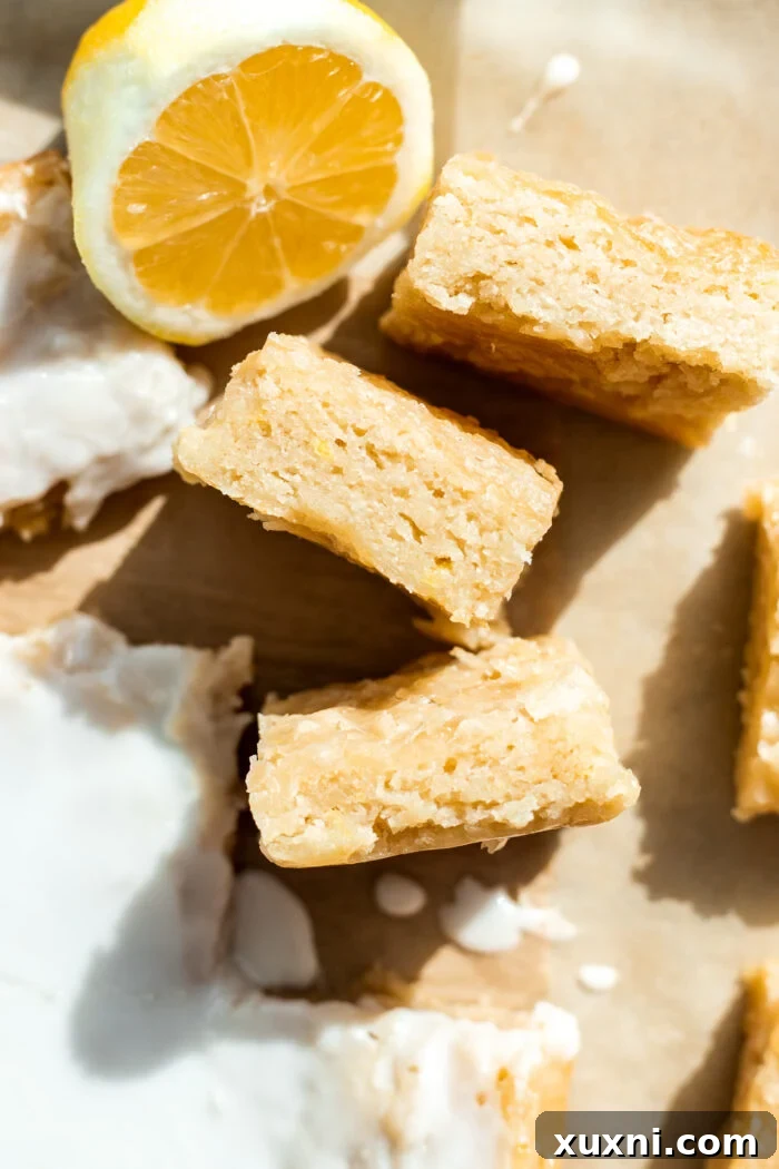 lemon brownies sliced on parchment paper