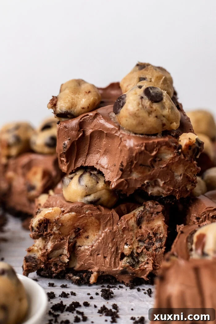 Easy No-Bake Vegan Brownie-Cookie Dough Cheesecake Bars 2 stacked vegan cookie dough cheesecake bars