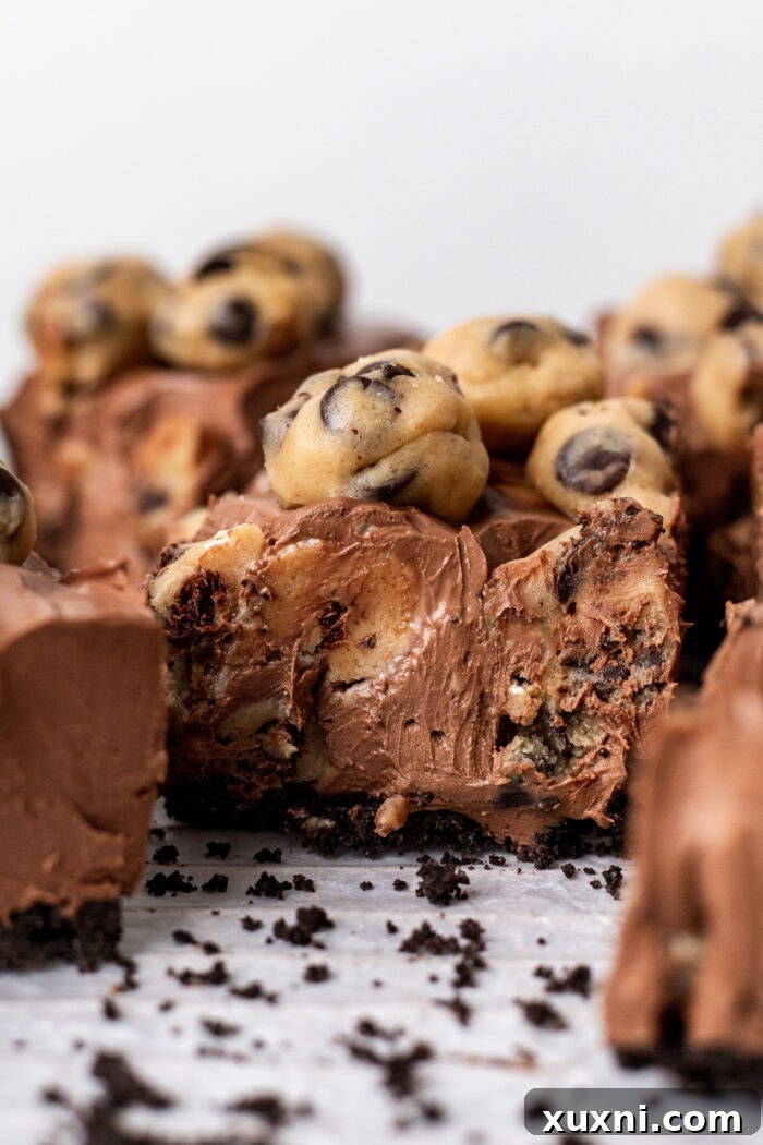 Easy No-Bake Vegan Brownie-Cookie Dough Cheesecake Bars 3 sliced vegan cookie dough cheesecake bars