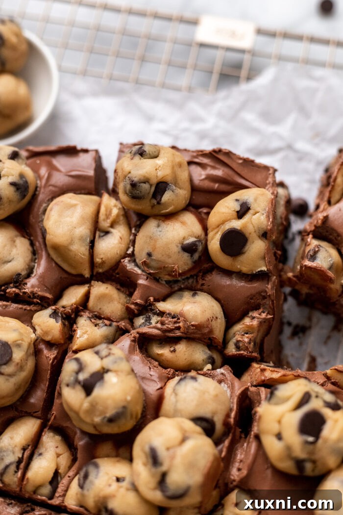 Easy No-Bake Vegan Brownie-Cookie Dough Cheesecake Bars 5 sliced cookie dough brownie cheesecake bars