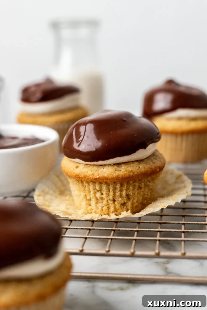 chocolate ganache on Boston cream pie cupcake