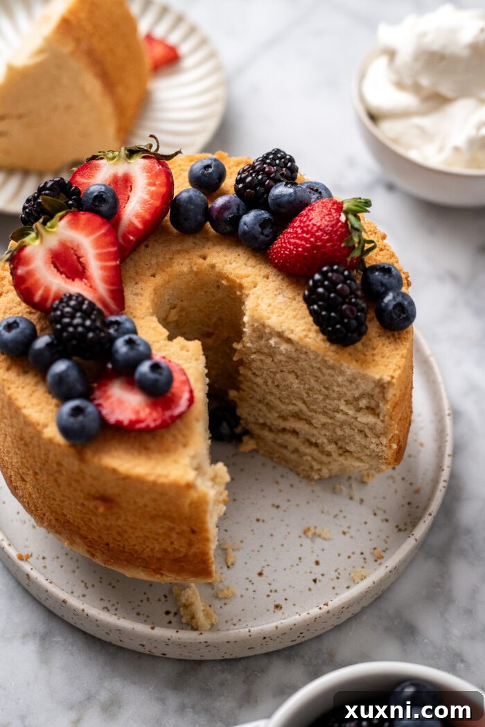 Heavenly Vegan Angel Food Cake 21 A beautifully sliced piece of vegan angel food cake on a plate, showing its delicate crumb.