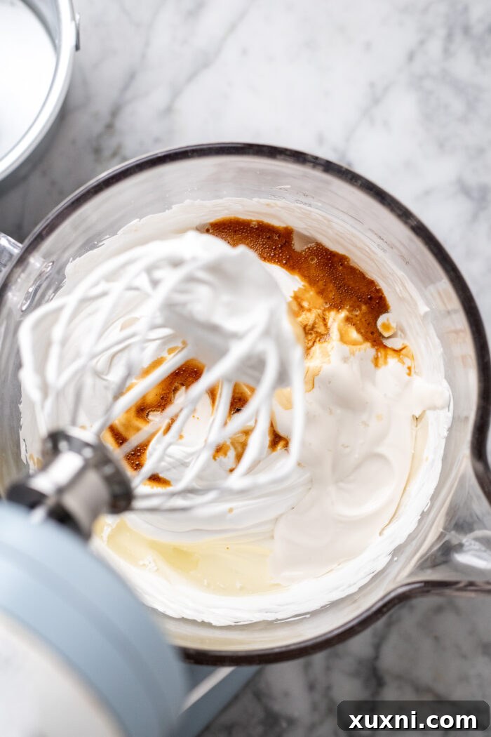 Heavenly Vegan Angel Food Cake 10 Adding dairy-free yogurt, neutral oil, vanilla extract, and sea salt into the meringue.