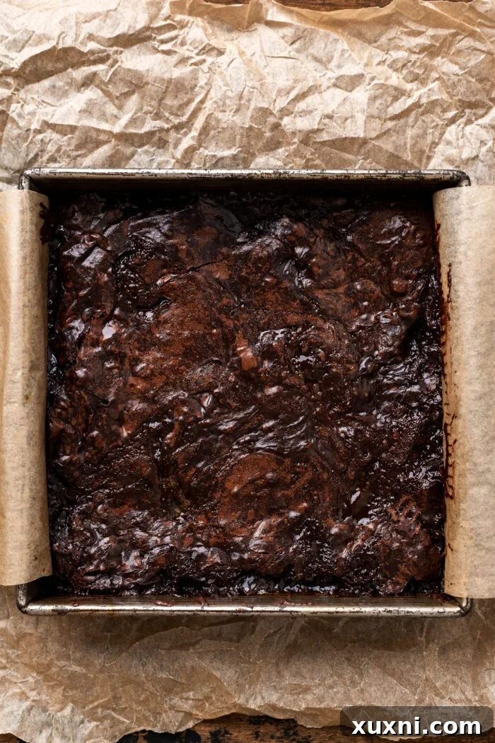 Freshly baked vegan salted caramel brownies cooling in the pan