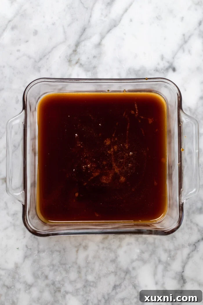 Thick homemade vegan caramel cooling in a square dish
