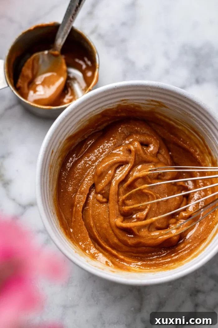 peanut butter swirl batter in a bowl, ready for mixing into the cake