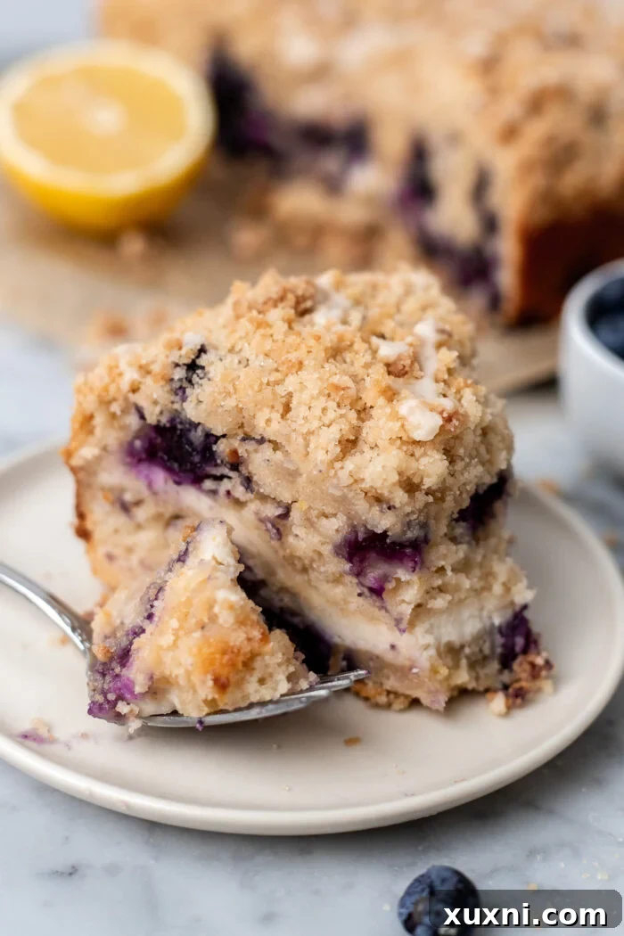 slice of vegan lemon blueberry coffee cake on a plate