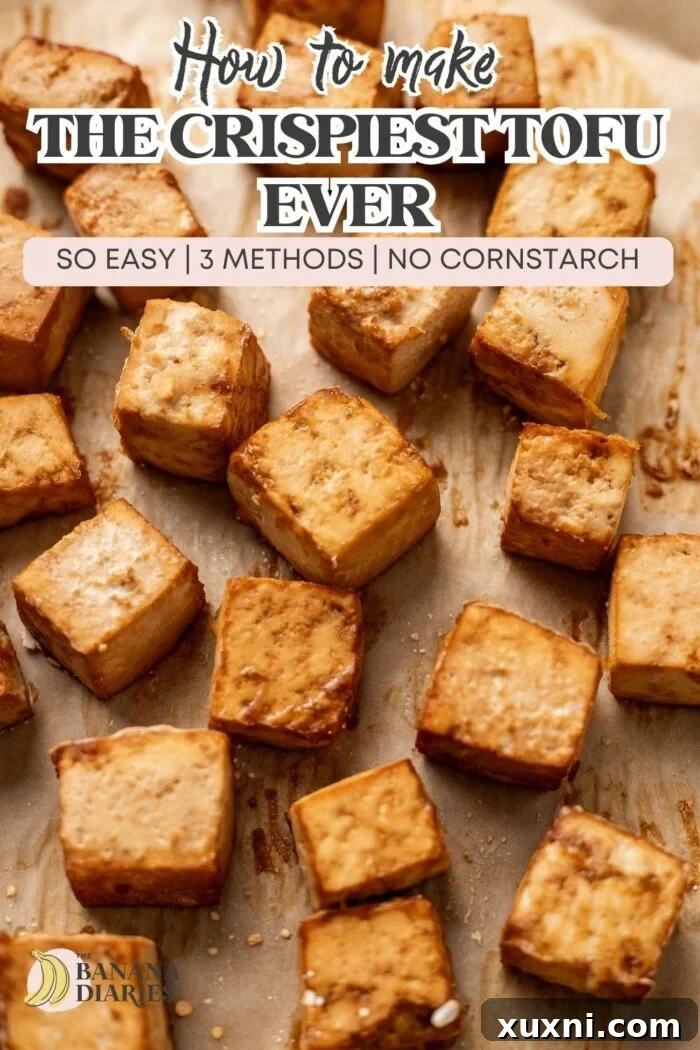 Pinterest pin image featuring crispy tofu with a title: 'Beginner’s Guide to How to Cook Tofu: Baked, Air Fryer, or Sautè'.