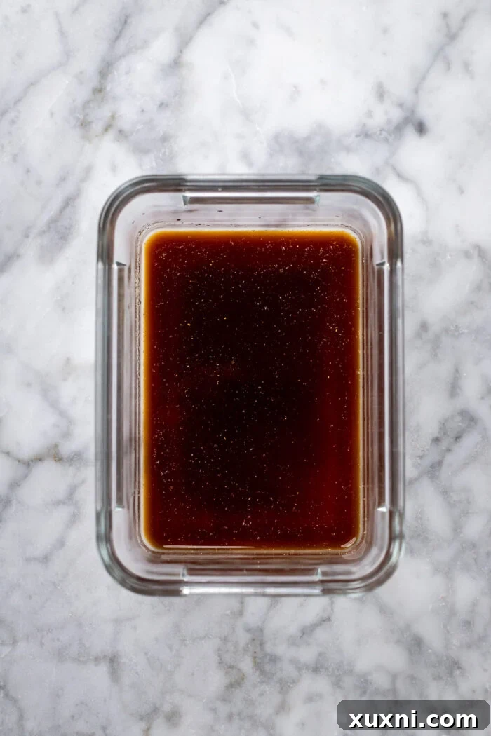 Fresh ingredients for the tofu marinade: soy sauce, rice vinegar, avocado oil, garlic powder, and onion powder.