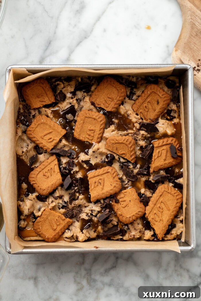 Heavenly Vegan Biscoff Butterscotch Bars 9 butterscotch cookie bars before final baking, topped with dough
