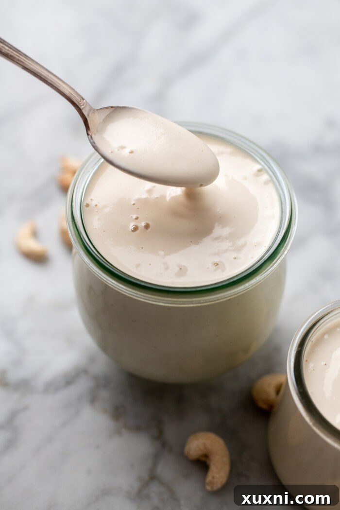 spoon dripping the cashew cream