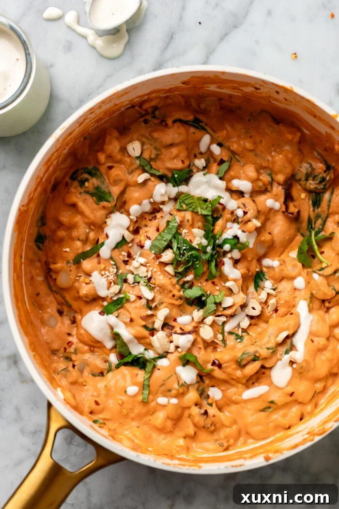 creamy garlicky butter beans in a saucepan