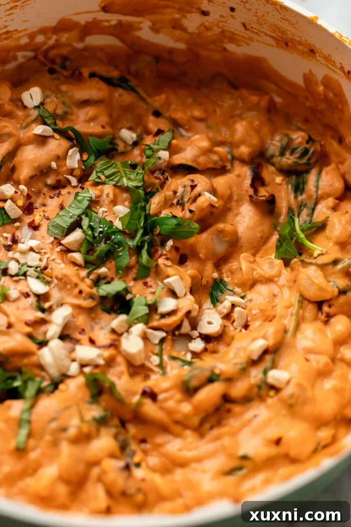 close up of creamy garlicky butter beans