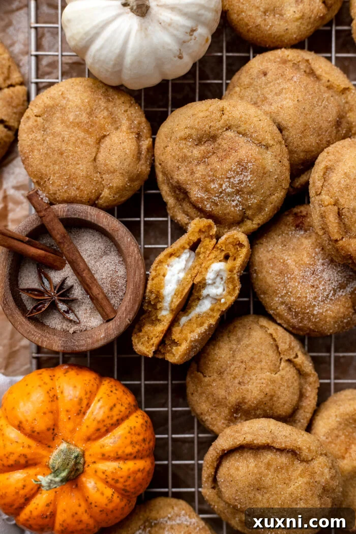 vegan pumpkin cheesecake cookies on a cooling rack