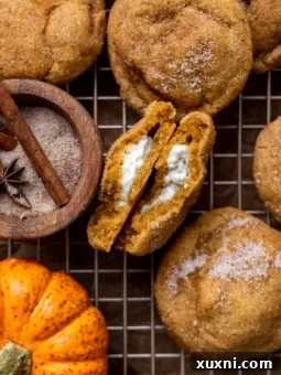 vegan pumpkin cheesecake cookies on cooling rack