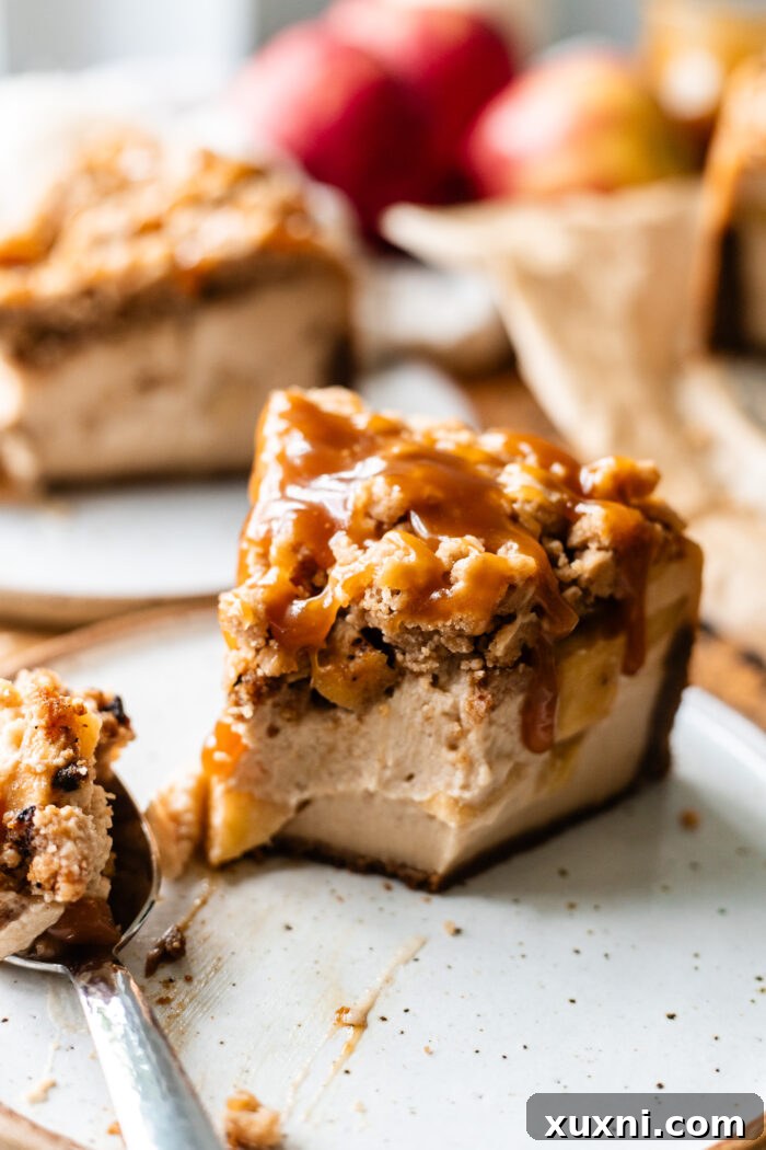 slice of bitten apple crumble cheesecake