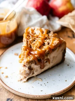 slice of vegan apple crumble cheesecake on a plate