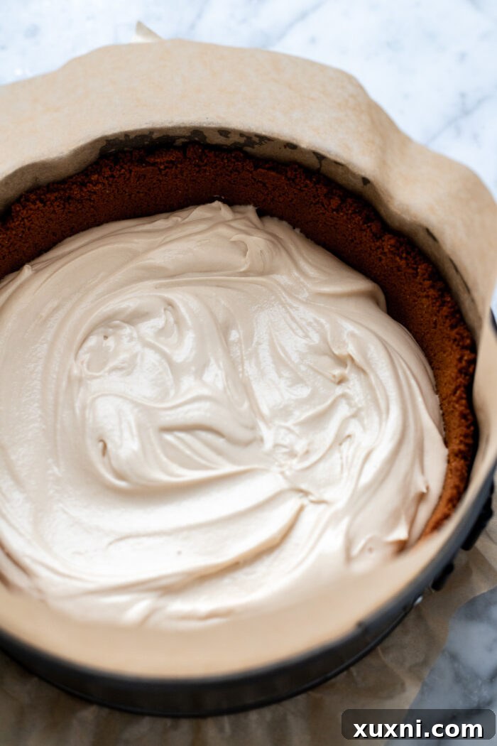 Assembling the apple crumble cheesecake