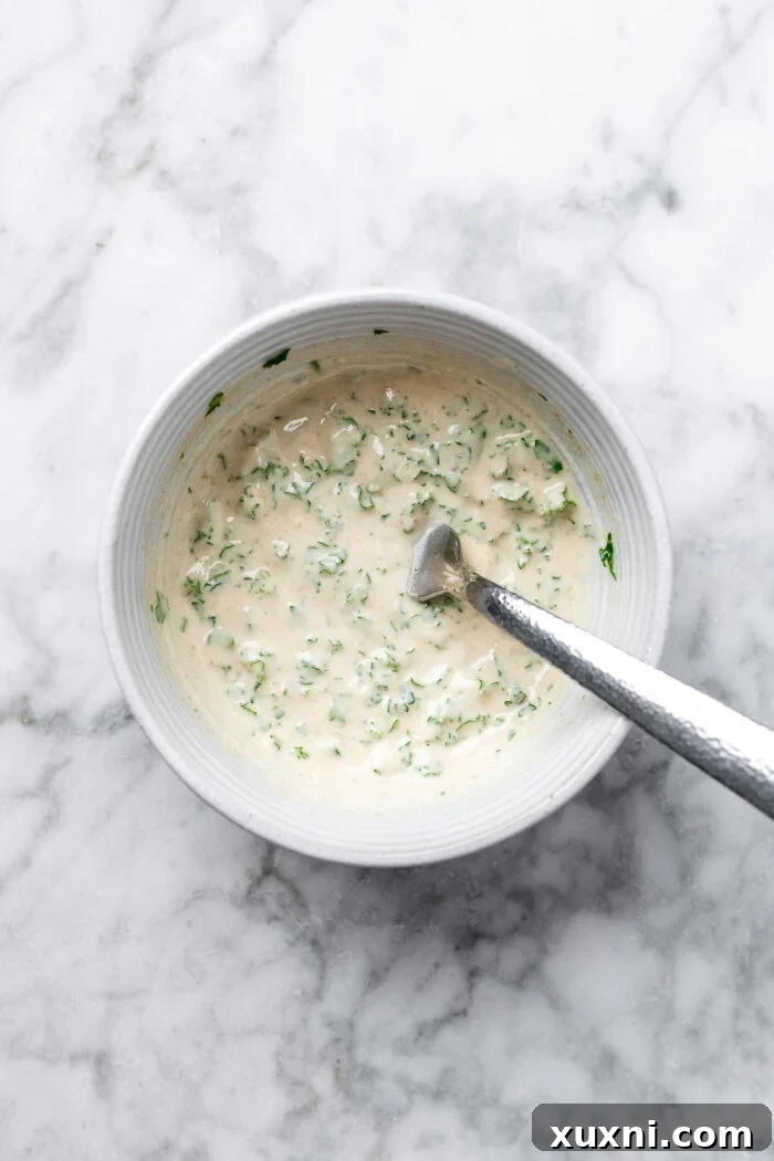 Creamy tahini dressing fully mixed and ready