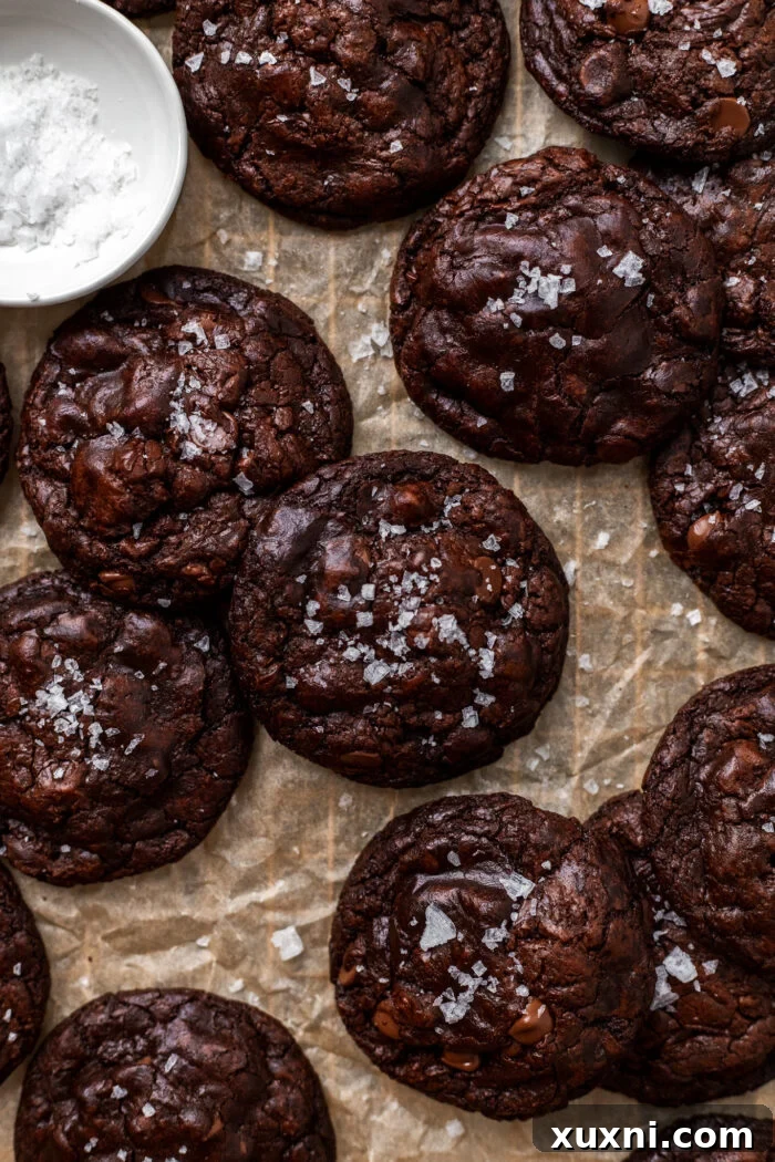 Effortless Fudgy Vegan Brownie Cookies 3 A closer look at vegan brownie cookies on parchment paper, highlighting their texture