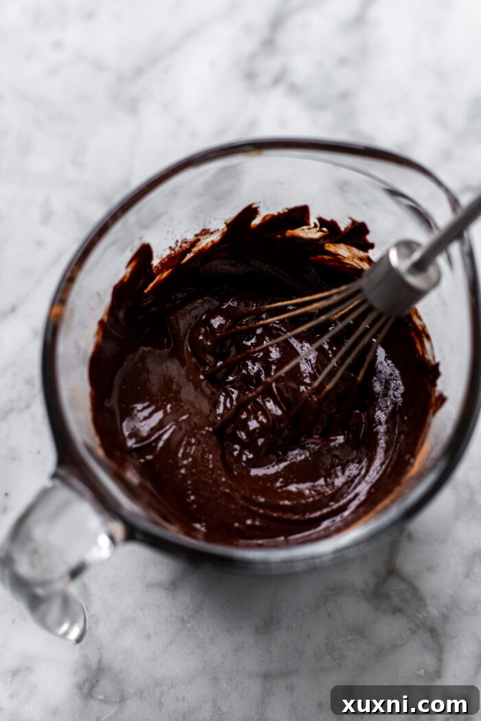 Effortless Fudgy Vegan Brownie Cookies 5 Fudge sauce in a bowl, showing its glossy, smooth texture