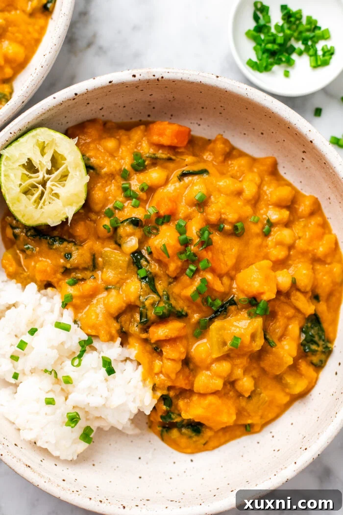 Creamy Peanut Butter Sweet Potato Curry with Chickpeas and Kale 3 Close-up shot of the creamy sweet potato curry, highlighting its rich texture and colorful ingredients.