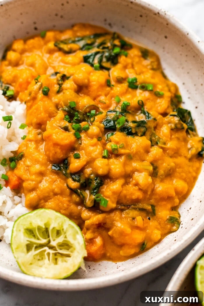 Creamy Peanut Butter Sweet Potato Curry with Chickpeas and Kale 5 A close-up of the sweet potato curry in a bowl, showcasing its inviting texture and vibrant color.