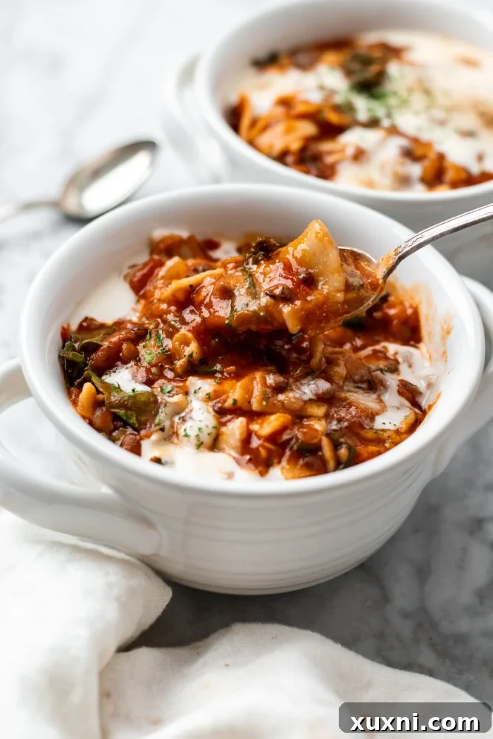 big bowl of vegan lasagna soup with spoon